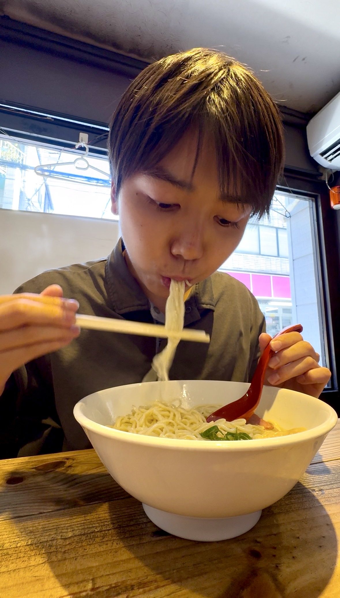 Hiro eating a bowl of ramen